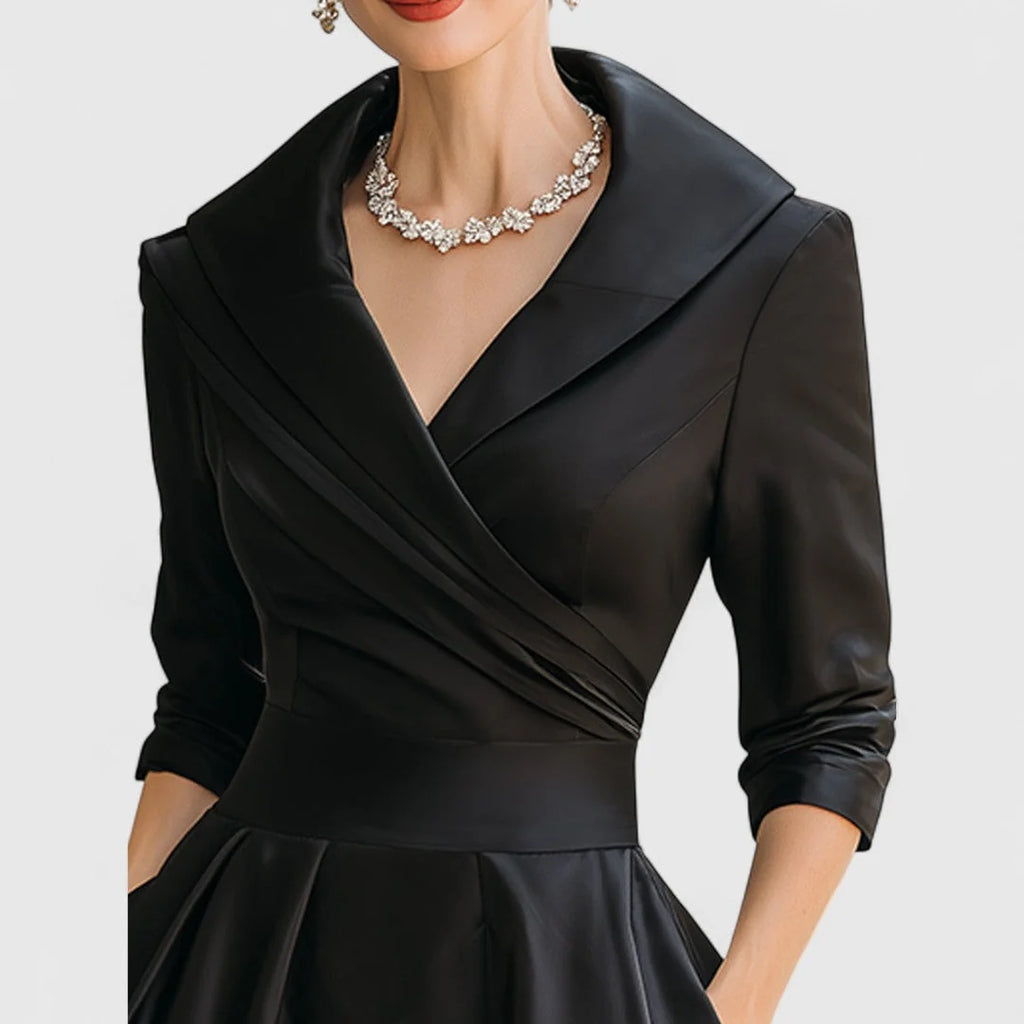 Full-length view of wrap bodice midi dress showing midi length and fit-and-flare silhouette