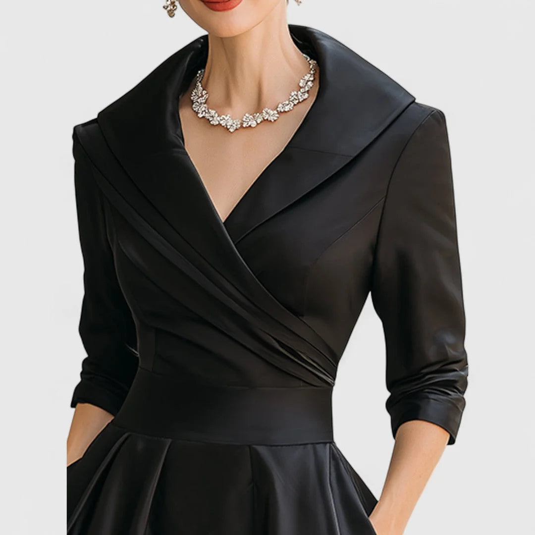 Full-length view of wrap bodice midi dress showing midi length and fit-and-flare silhouette