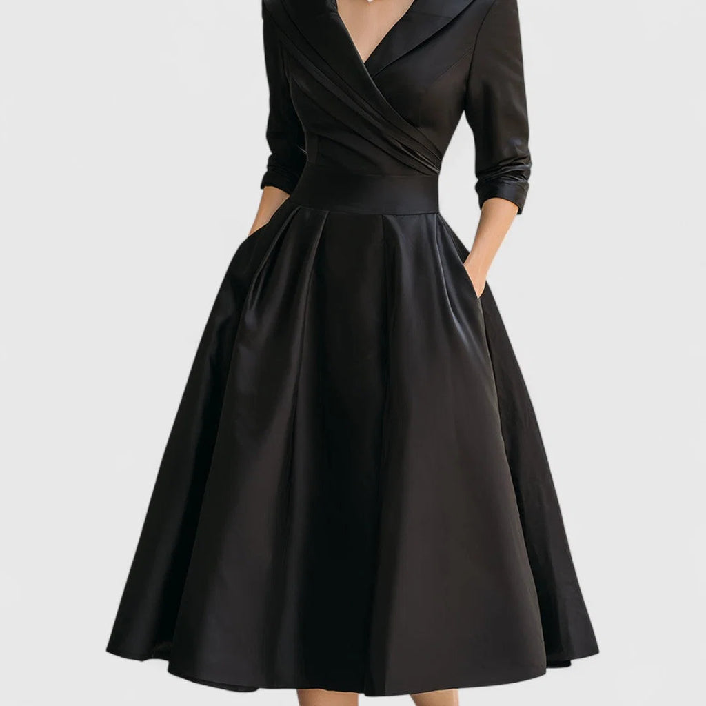 Wrap bodice midi dress styled with statement jewellery for formal occasion wear