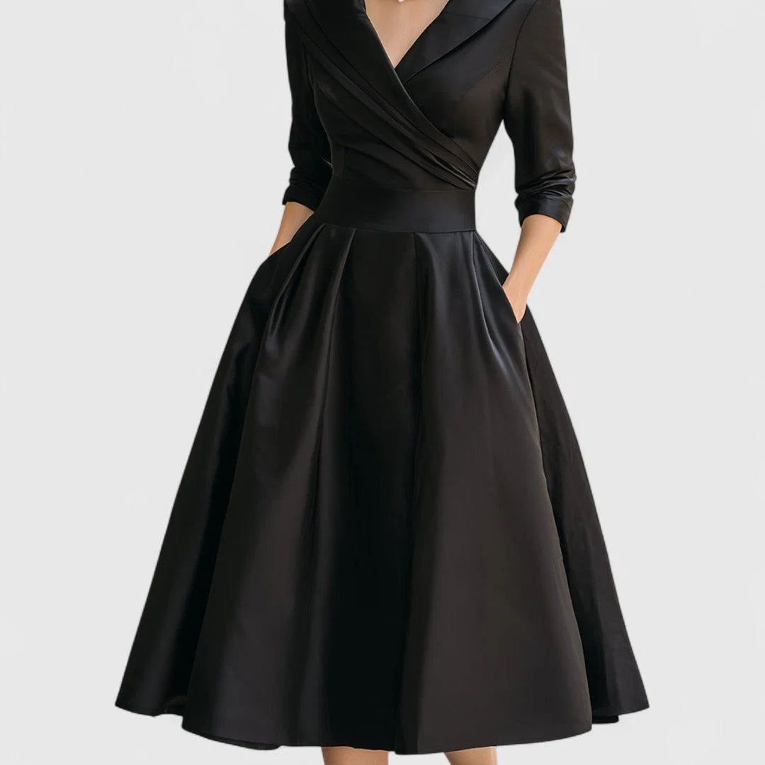 Wrap bodice midi dress styled with statement jewellery for formal occasion wear