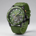 Men's chronograph watch with green silicone strap, 44mm black case, rotating bezel, and textured dial