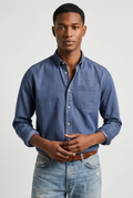 Men's long sleeve denim shirt in mid-blue with button-up front and chest pocket, relaxed fit for casual wear