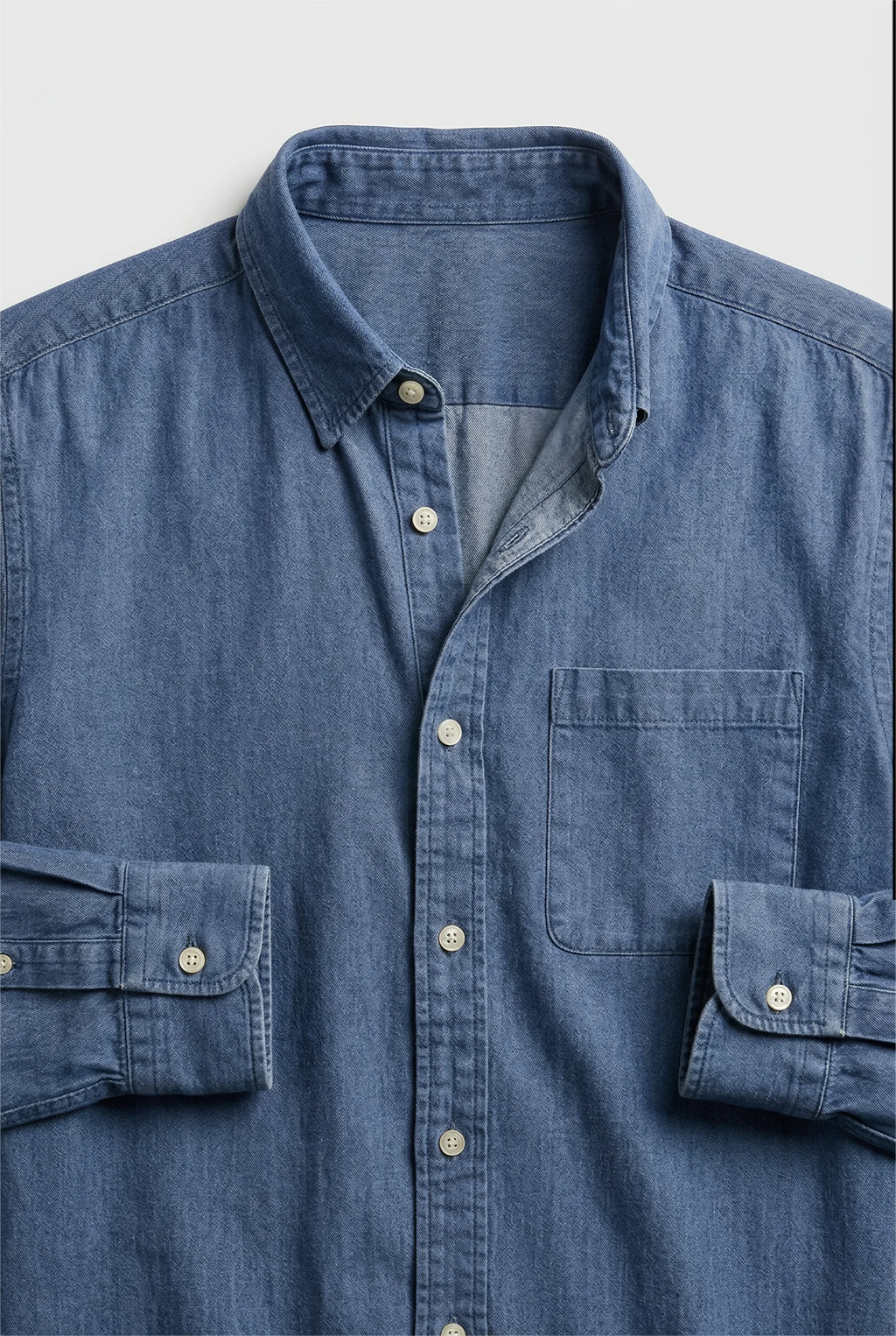 Men's casual denim shirt with long sleeves and button cuffs, versatile layering piece for everyday styling