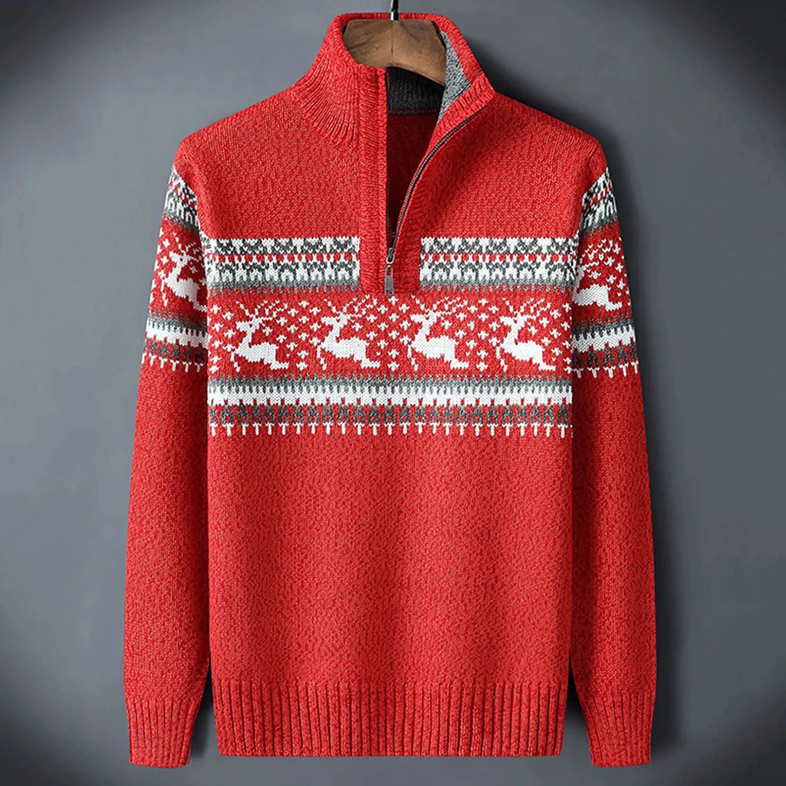 Close-up view of Fair Isle pattern detailing on men's navy half-zip jumper with cream motifs