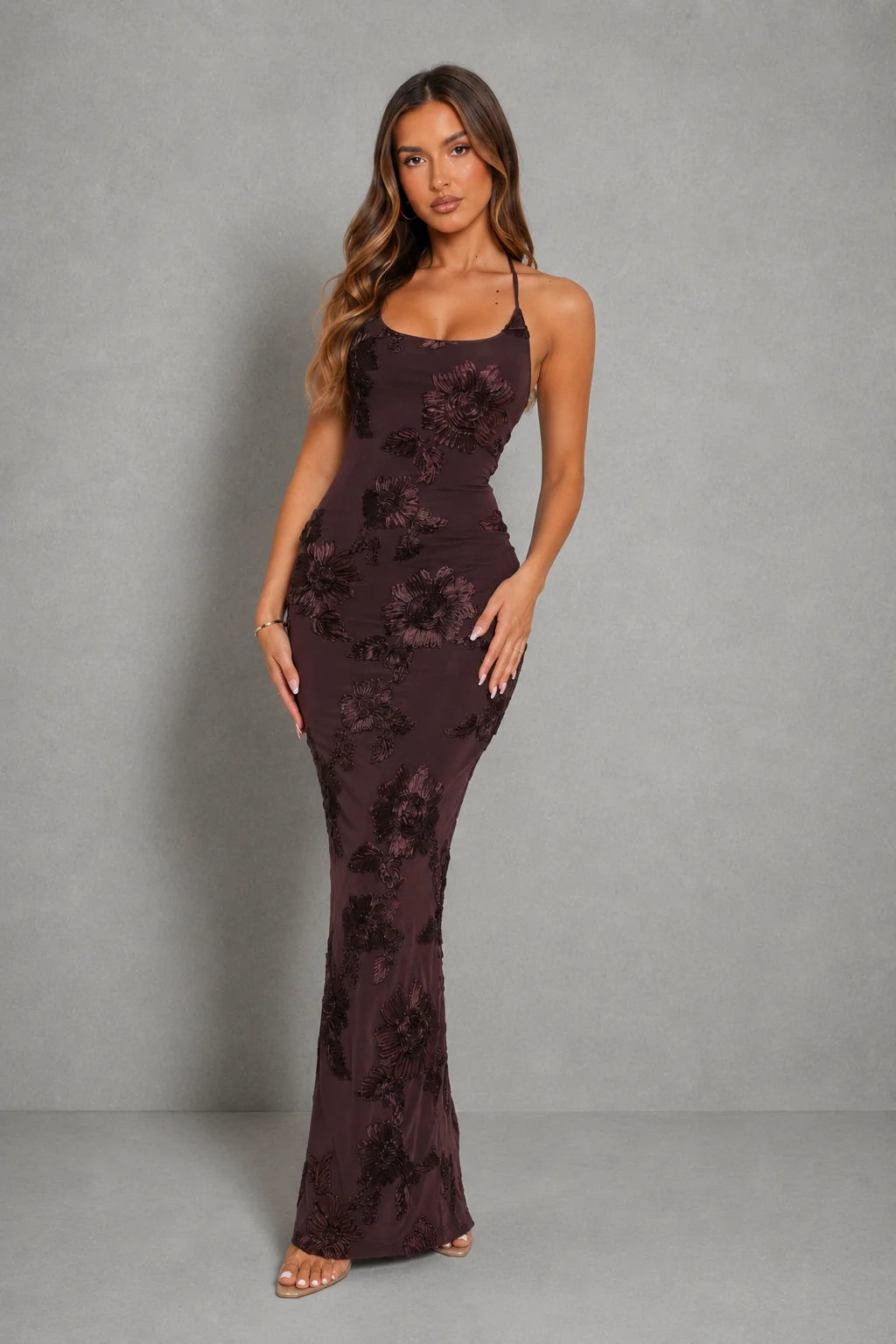 Detail shot of smooth fabric finish and fully lined construction on halter maxi dress
