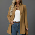 Camel women's A-line coat with stand collar and button-front closure styled over white top and jeans