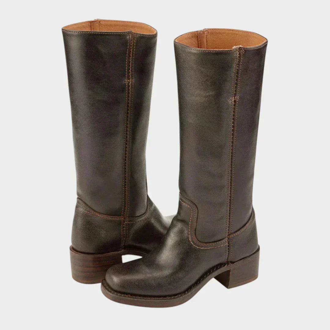 Side view of women's knee-high boots showing mid-calf silhouette and centre seam detail
