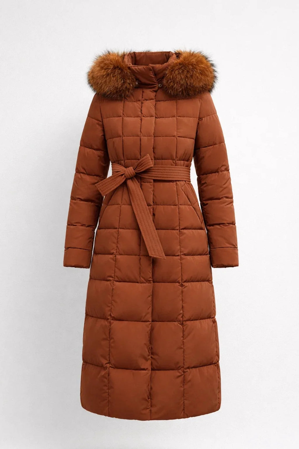 Side view of women's long puffer coat showing quilted box pattern and belted waist detail with faux fur hood