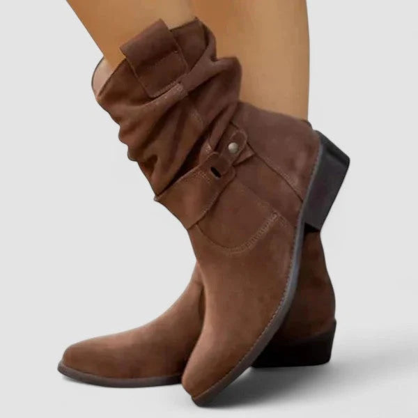 Full view of women's slouchy ankle boots in beige with side zip and block heel