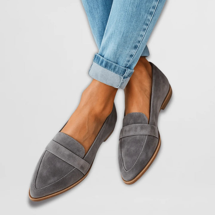 Close-up view of women's suede loafers showing soft-touch finish and classic slip-on construction
