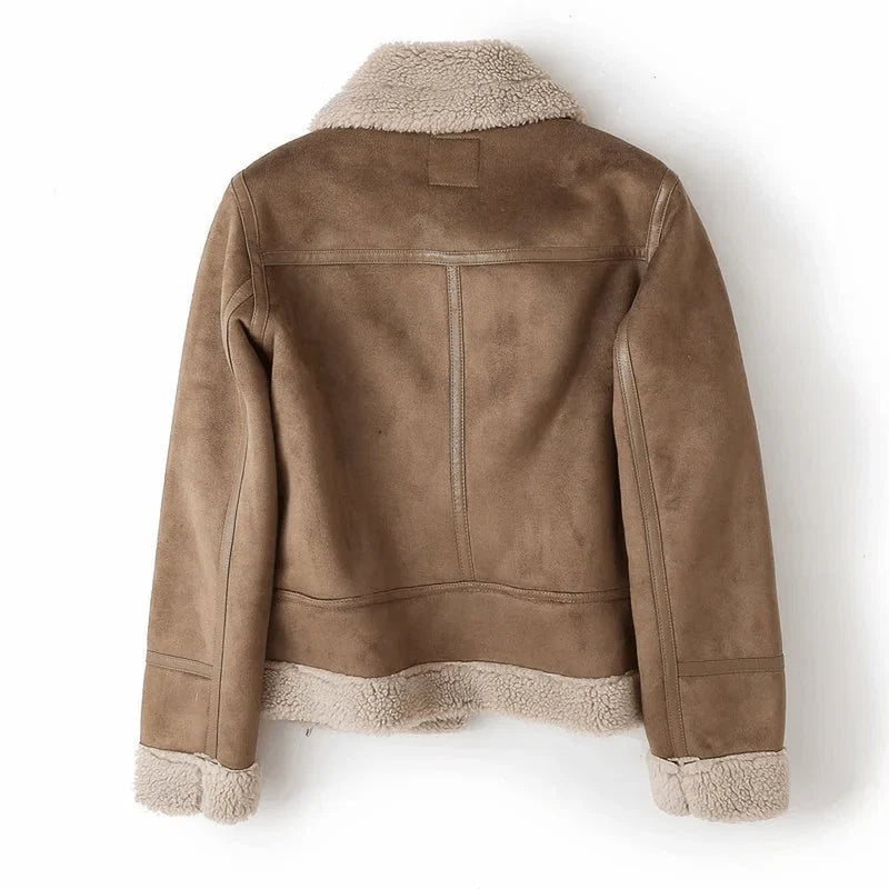 Side view of women's aviator jacket with zip pockets and belted waist detail
