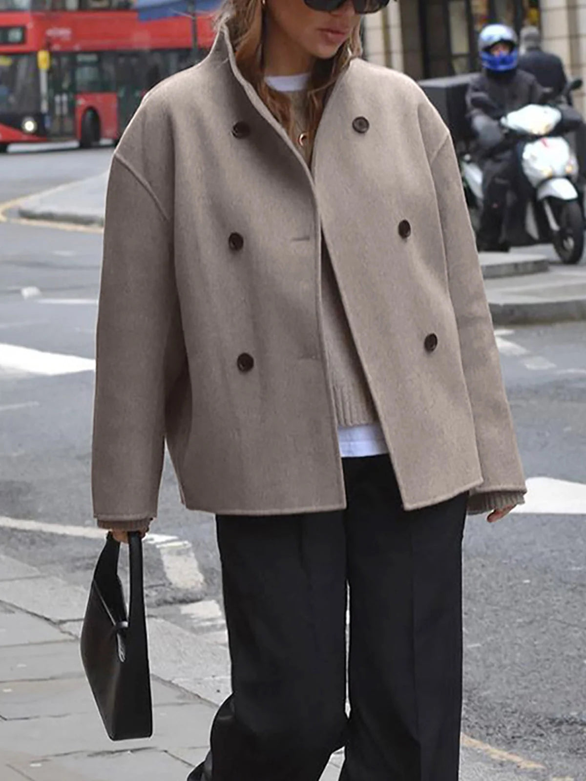 Back view of women's double breasted pea coat showing relaxed shoulder line