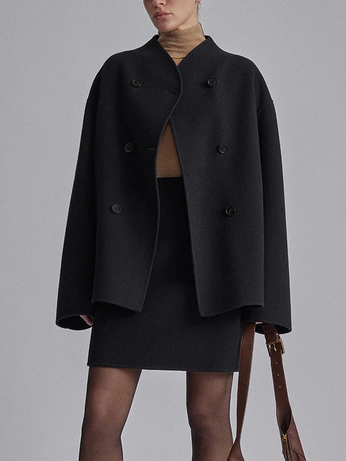 Women's pea coat in black showing versatile styling for formal occasions