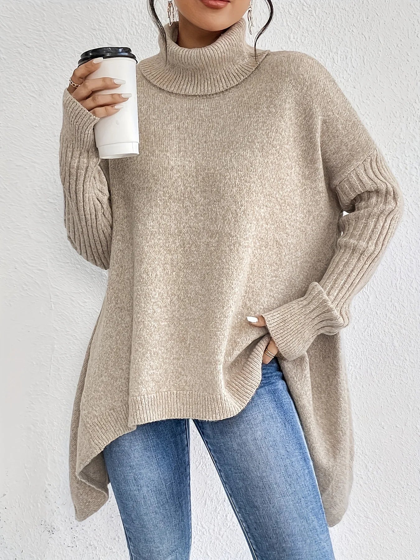 Full-length view of oversized turtleneck jumper showing relaxed proportions and contemporary knitwear styling