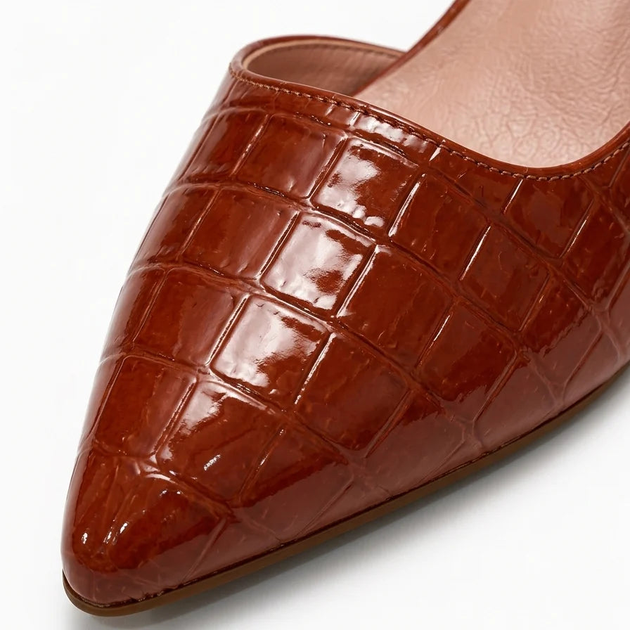 Side view of women's slingback pumps showing elastic strap and stable block heel construction