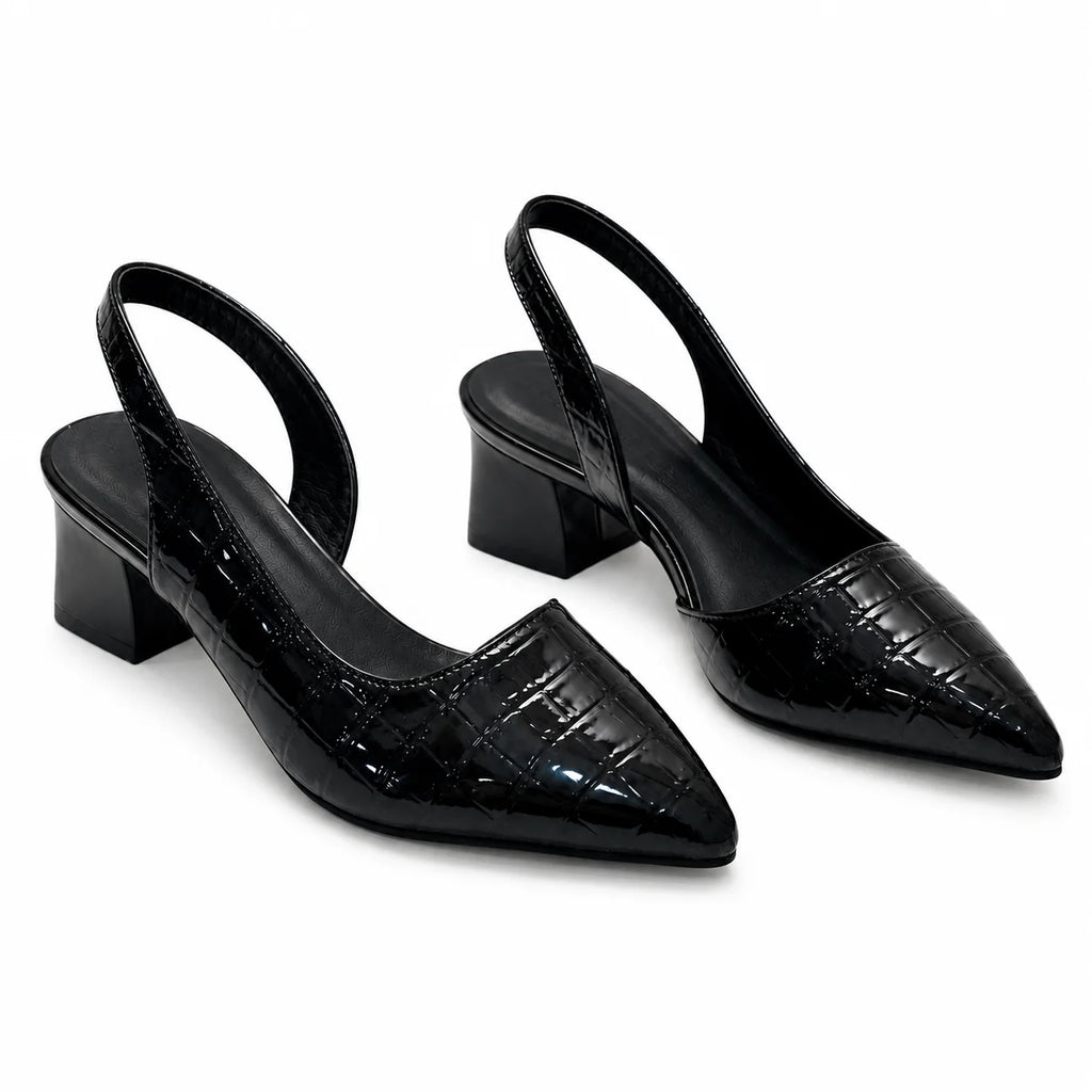 Top view of pointed-toe slingback heels showing crocodile pattern and structured upper design