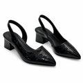 Top view of pointed-toe slingback heels showing crocodile pattern and structured upper design