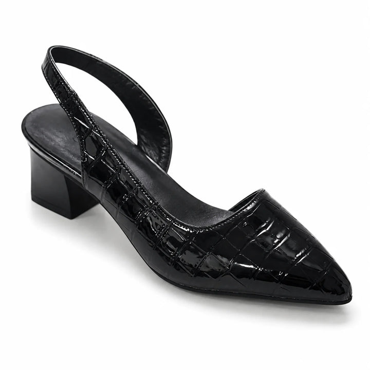 Close-up of block heel construction and crocodile-embossed detailing on slingback pumps