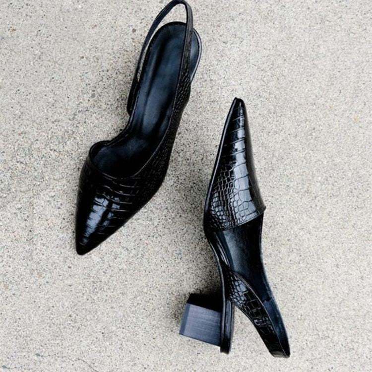 Side profile of pointed-toe slingback heels with mid-height block heel and textured finish