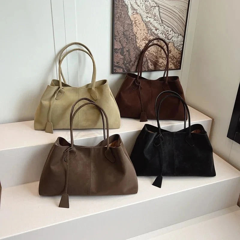 Women's structured tote bag in natural light showing true taupe colour