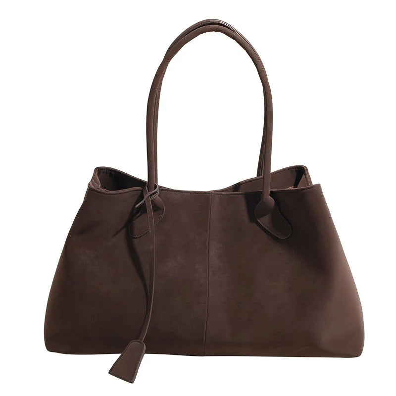 Side profile of tote bag showing depth and capacity for daily essentials
