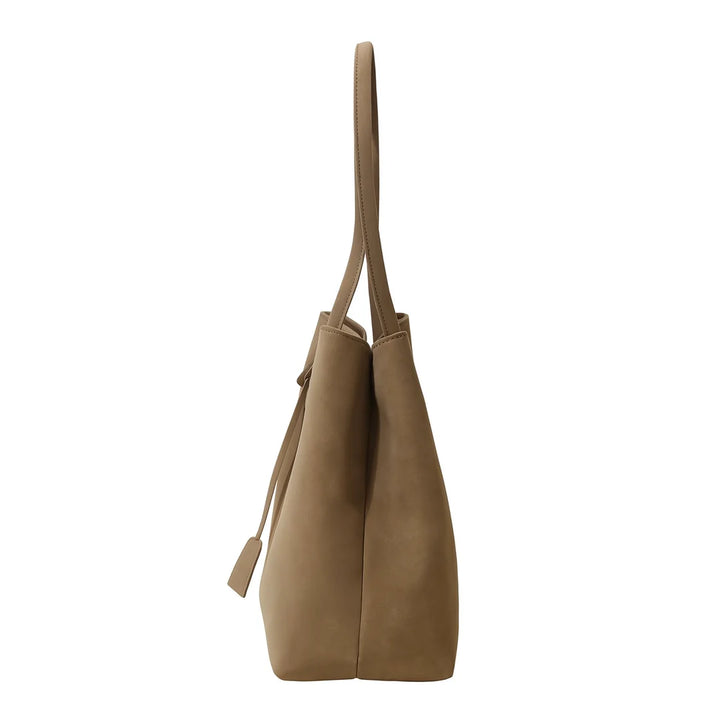 Side view of women's structured tote bag showing centre seam detail and smooth finish