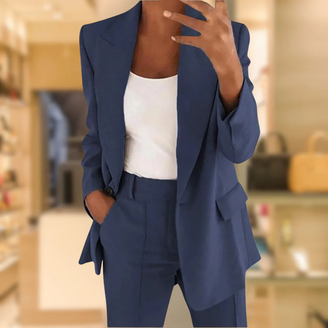 Detail shot of tailored suit set blazer with decorative cuff buttons and smooth woven finish