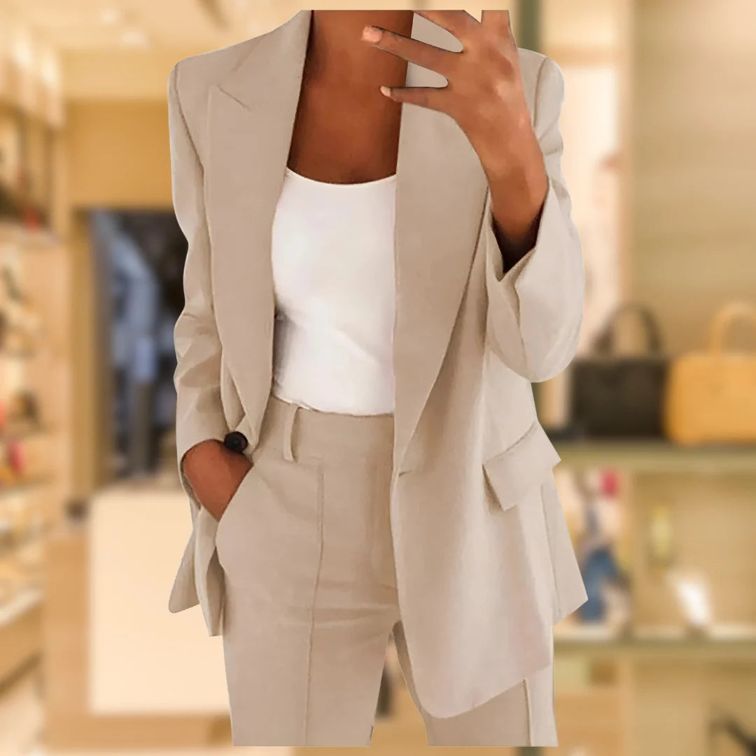 Full-length view of women's formal blazer trouser suit set in neutral tone for office and smart casual wear