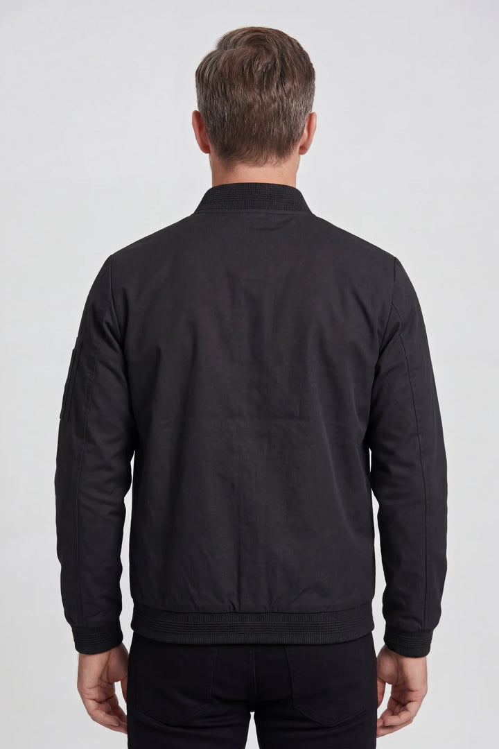 Front view of men's bomber jacket showing streamlined silhouette and sleeve zip pocket detail