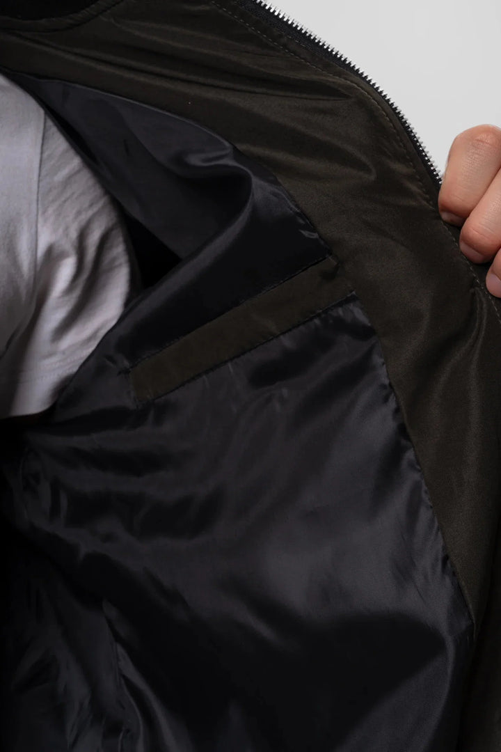 Men's bomber jacket worn casually showing practical sleeve pocket and front zip closure