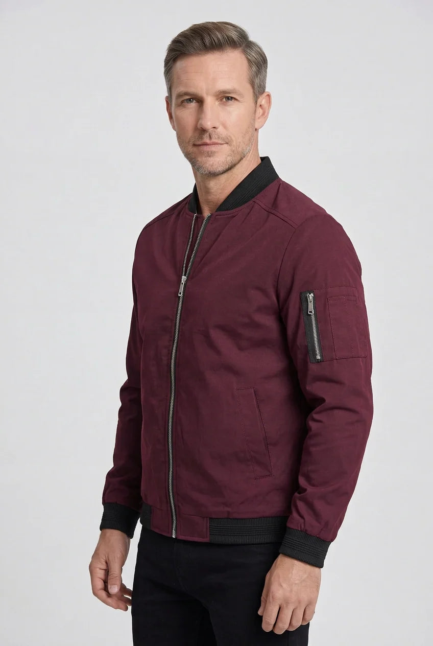 Full-length view of men's bomber jacket paired with dark trousers for smart casual styling