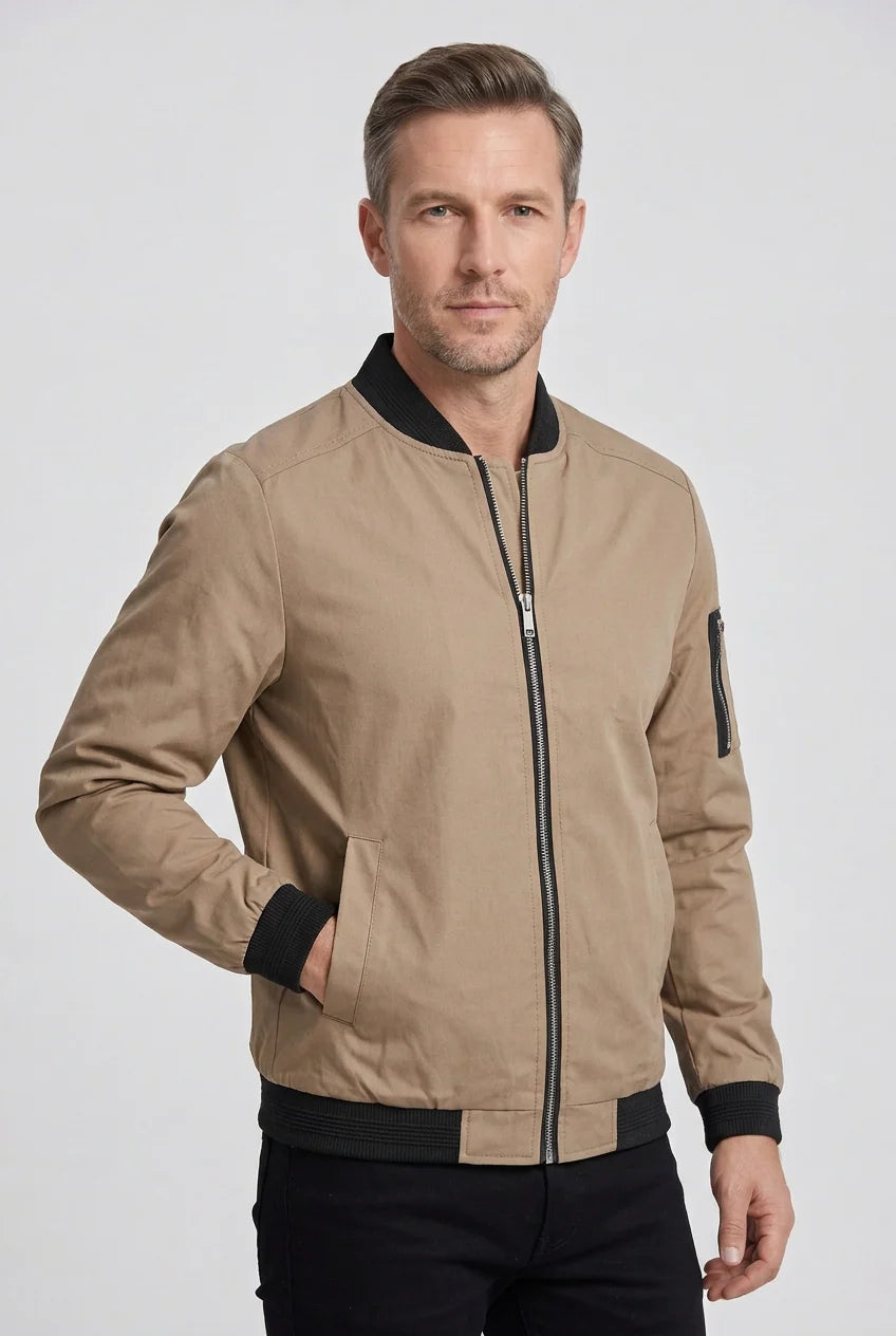 Men's bomber jacket sleeve detail highlighting functional zip pocket and ribbed cuff finish