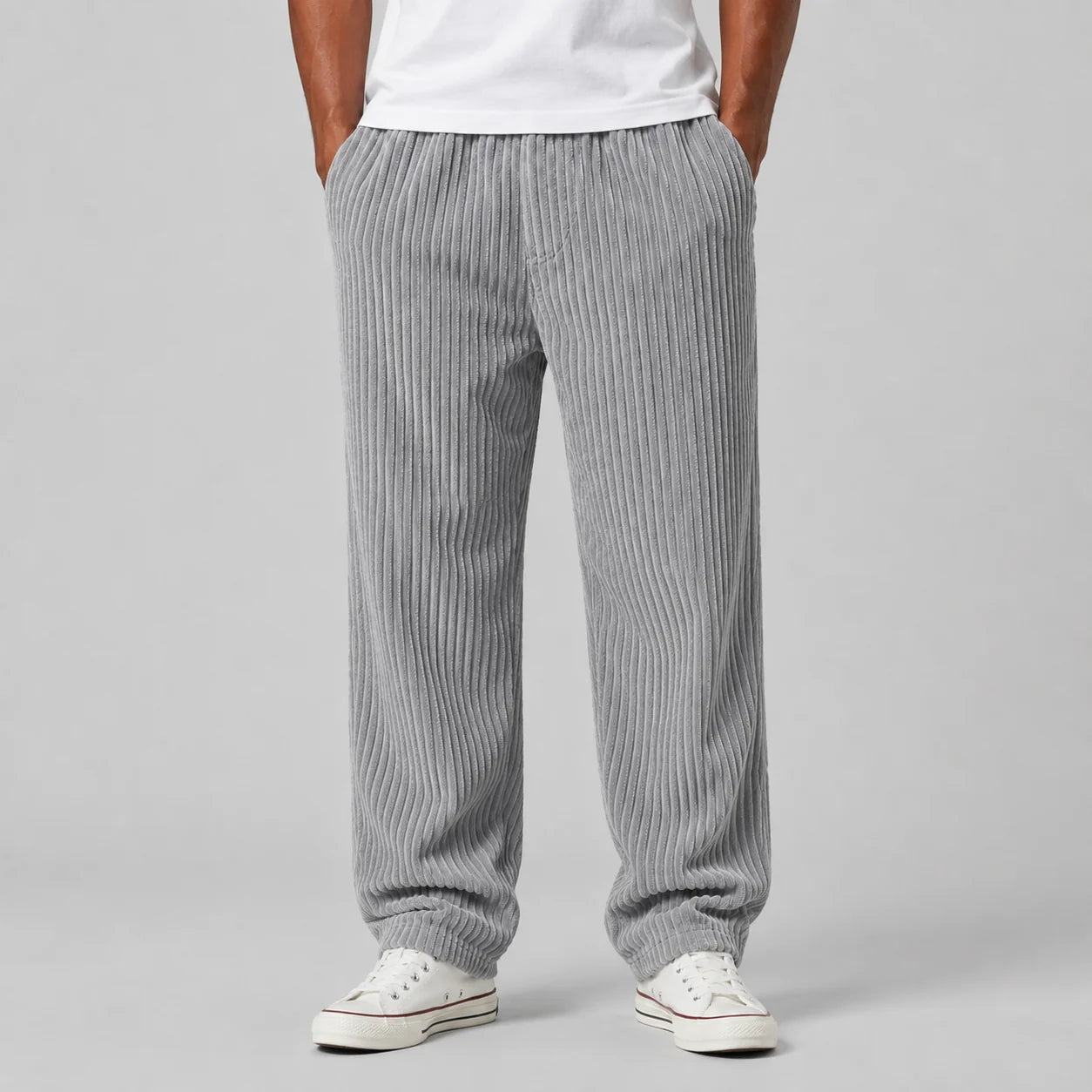 Men's corduroy trousers in grey with ribbed texture and relaxed fit shown from back