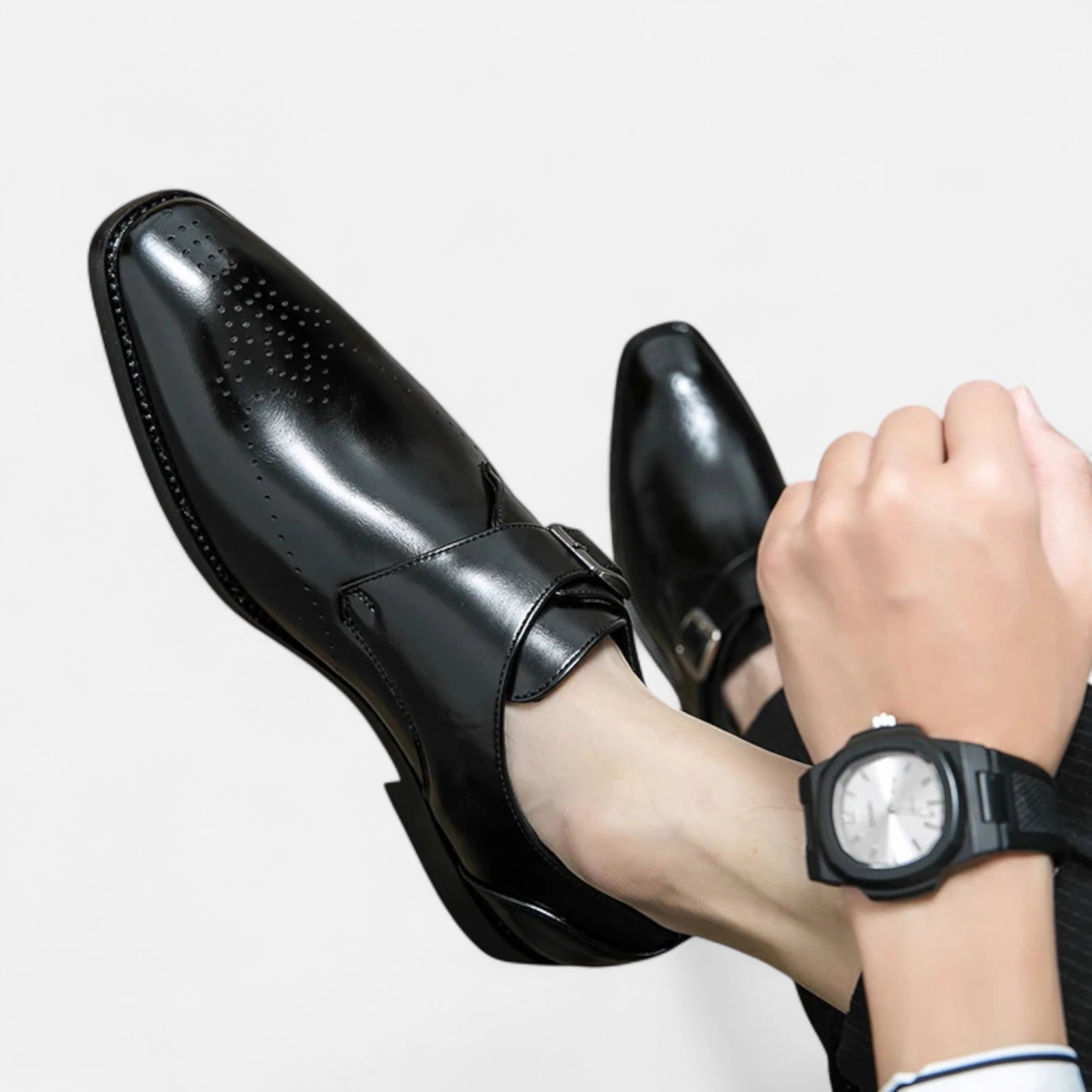 Close-up of buckle fastening on men's formal monk strap dress shoes