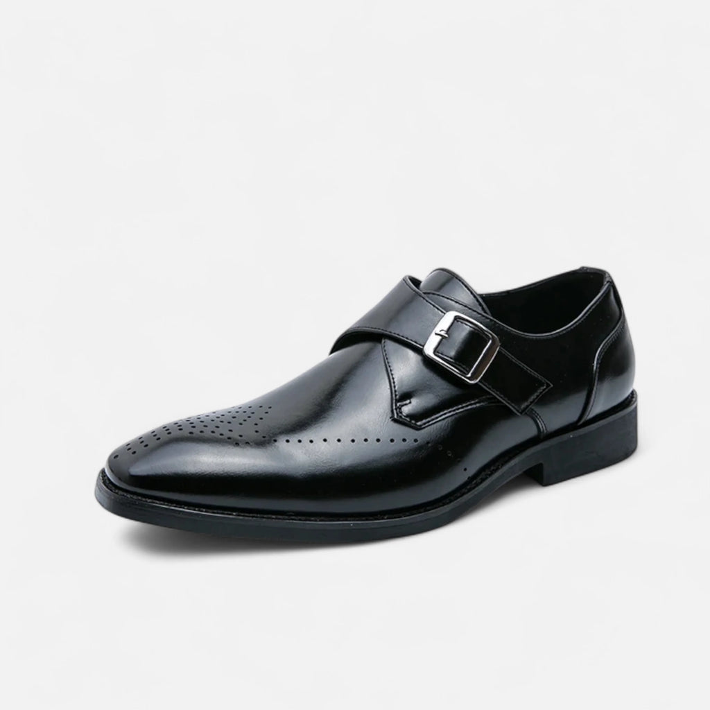 Detail shot of brogue perforations and sleek silhouette on formal monk strap shoes
