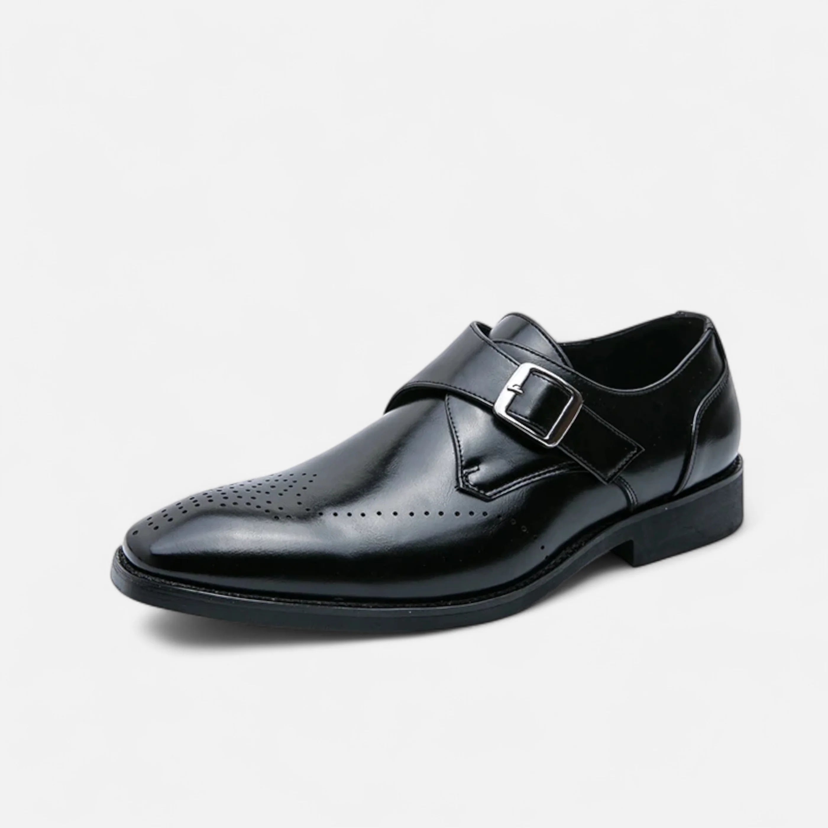 Detail shot of brogue perforations and sleek silhouette on formal monk strap shoes