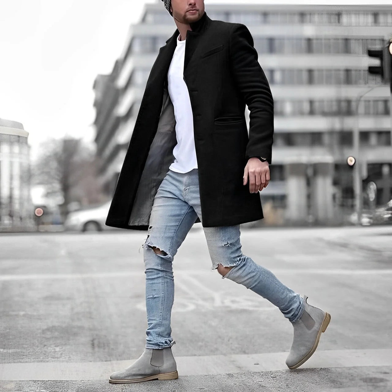 Grey men's overcoat showing structured tailoring and welt pocket detail on slim-fit silhouette