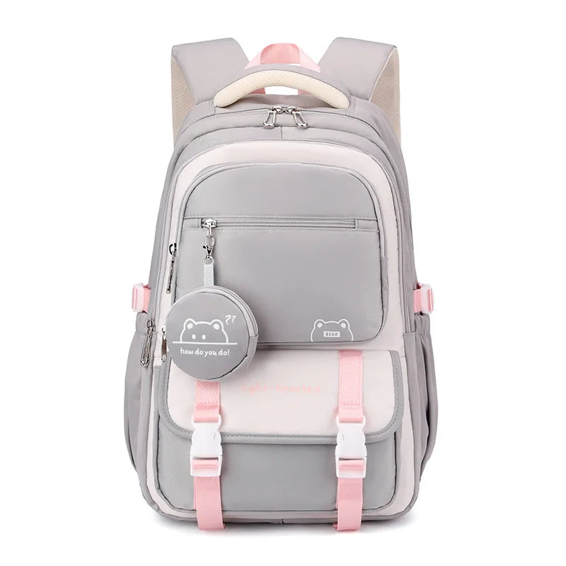 School backpack on model showing everyday wear styling with beige jumper and casual outfit