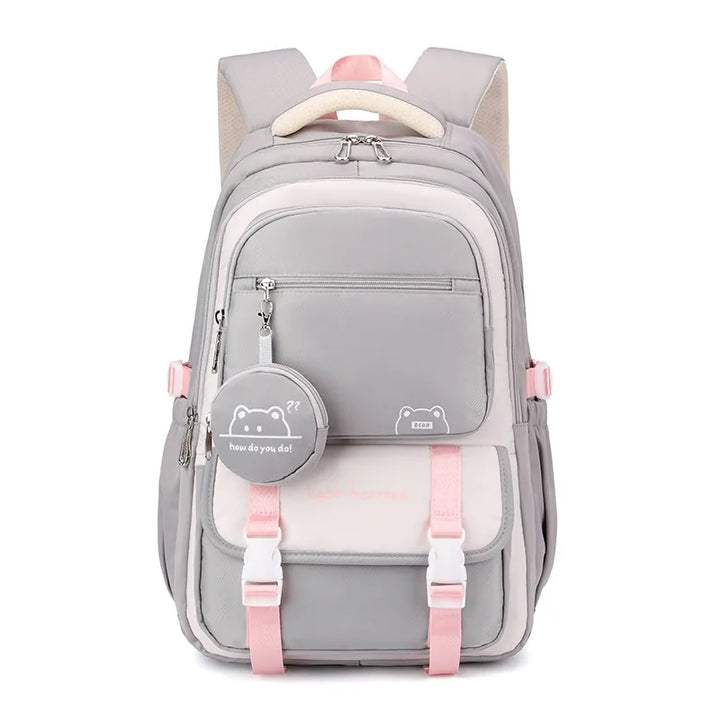 School backpack on model showing everyday wear styling with beige jumper and casual outfit