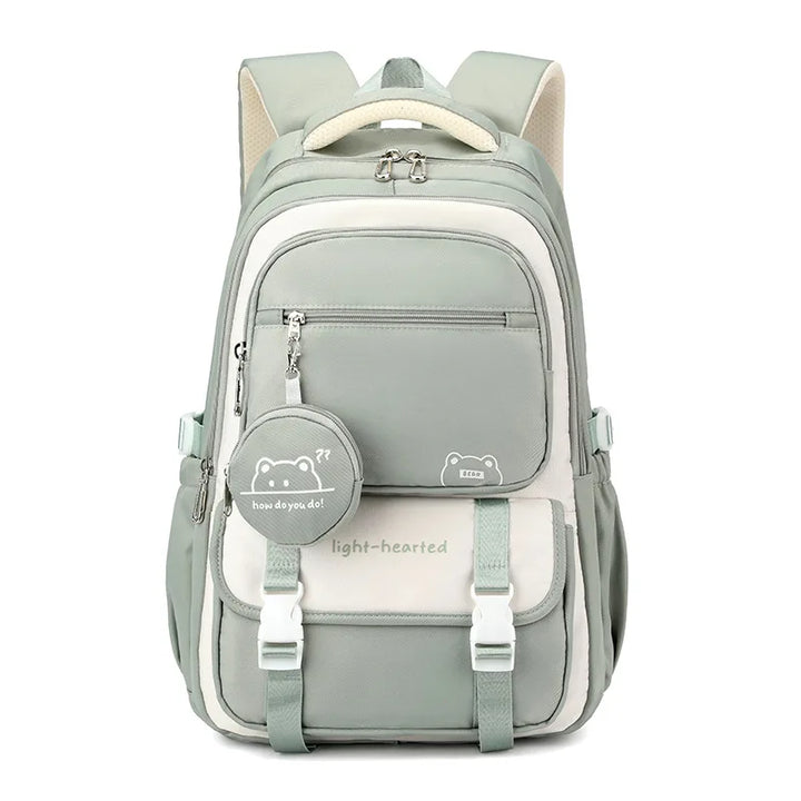 Close-up of school backpack front pocket zip with decorative bear graphic coin purse attachment