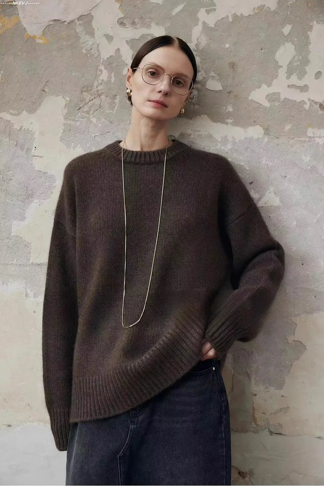 Women's cashmere sweater showing relaxed drape and oversized proportions
