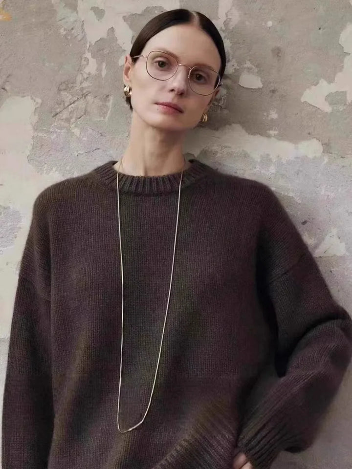 Grey cashmere sweater with crew neckline styled for casual weekend wear