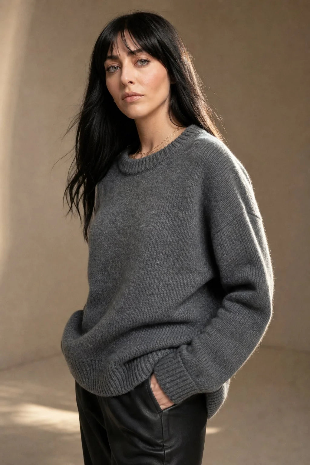 Close-up of cashmere sweater showing soft knit texture and ribbed collar detail