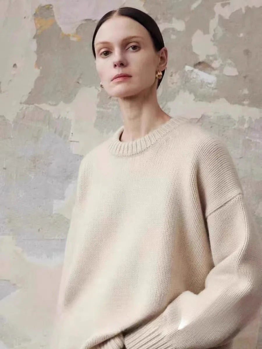 Women's cashmere sweater in grey showing soft drape and comfortable proportions