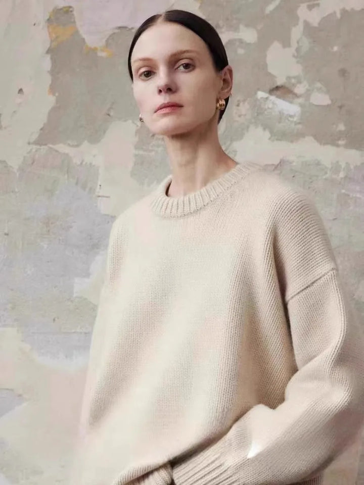 Women's cashmere sweater in grey showing soft drape and comfortable proportions