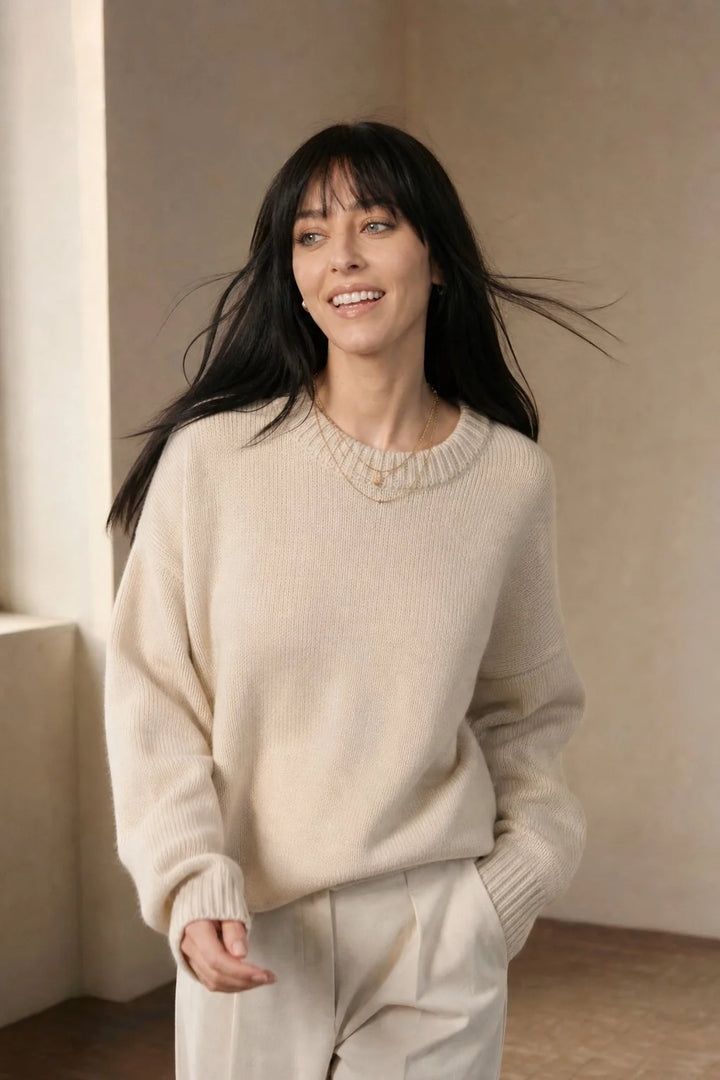 Side view of oversized cashmere jumper with drop shoulder sleeves and relaxed silhouette