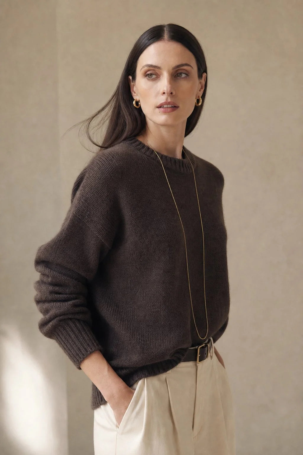 Back view of women's cashmere sweater showing relaxed oversized fit