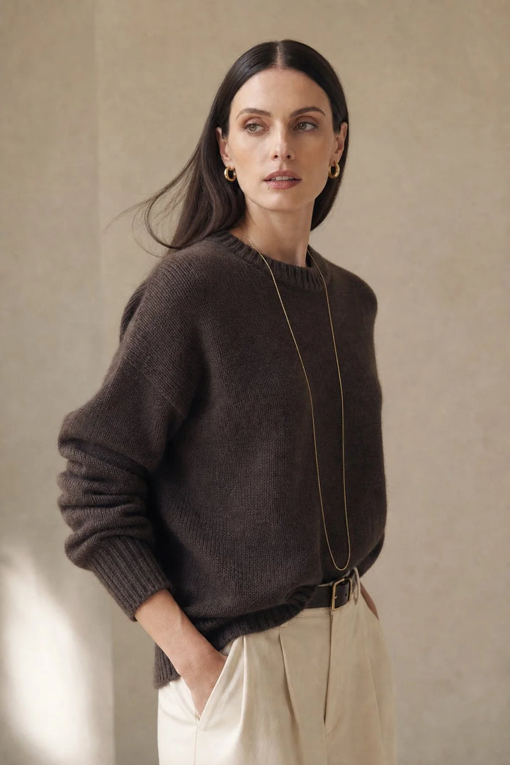 Back view of women's cashmere sweater showing relaxed oversized fit
