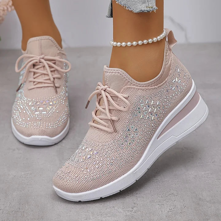 Close-up of women's trainers with rhinestone detailing and smooth finish fabric