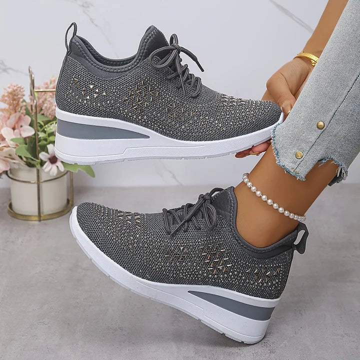 Women's rhinestone trainers displayed with lace-up design and pull tab at heel